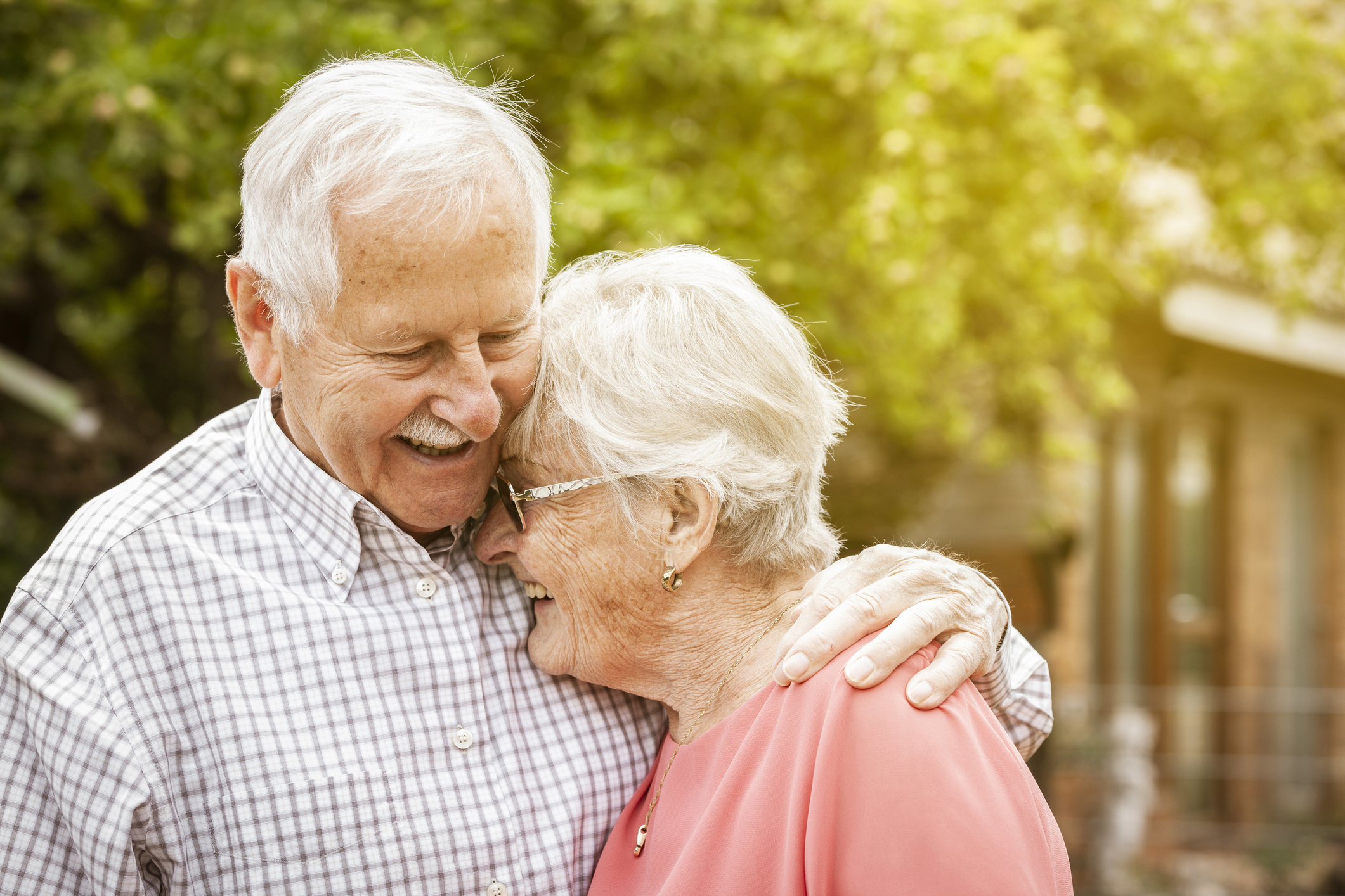 Senior couple laughing and hugging