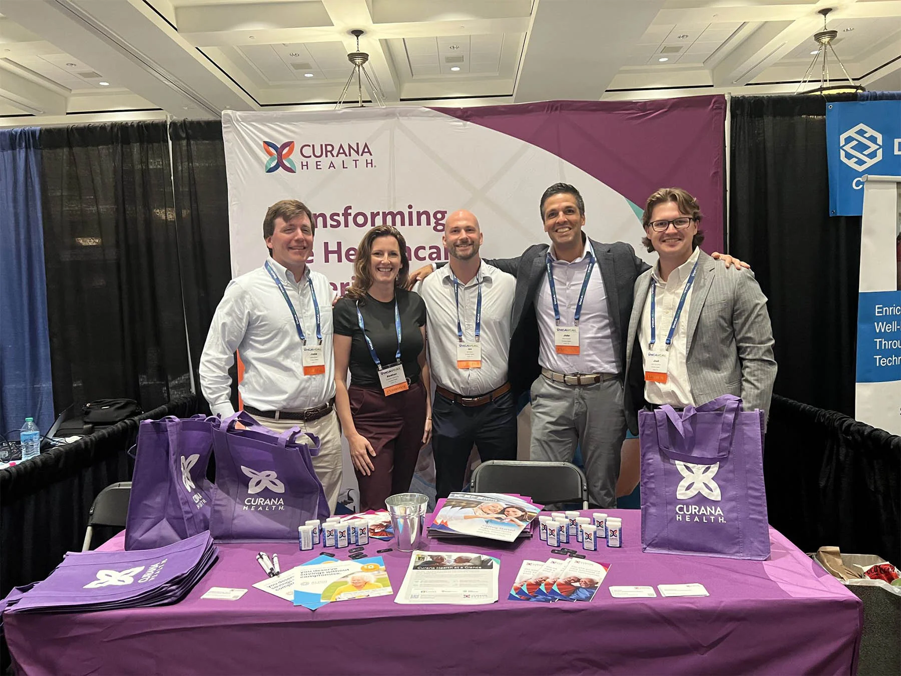Curana team at conference booth