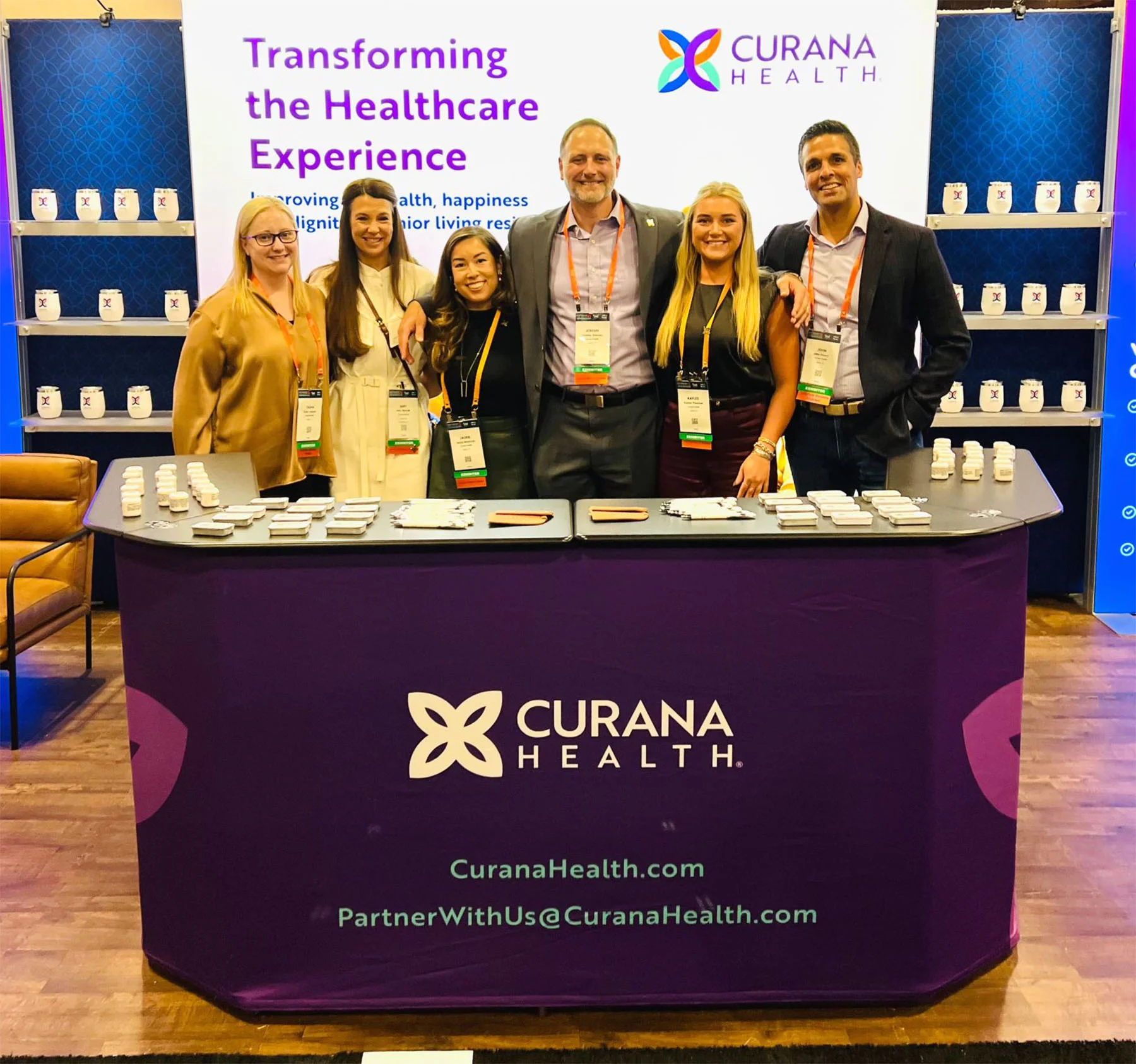 Curana team at a conference booth