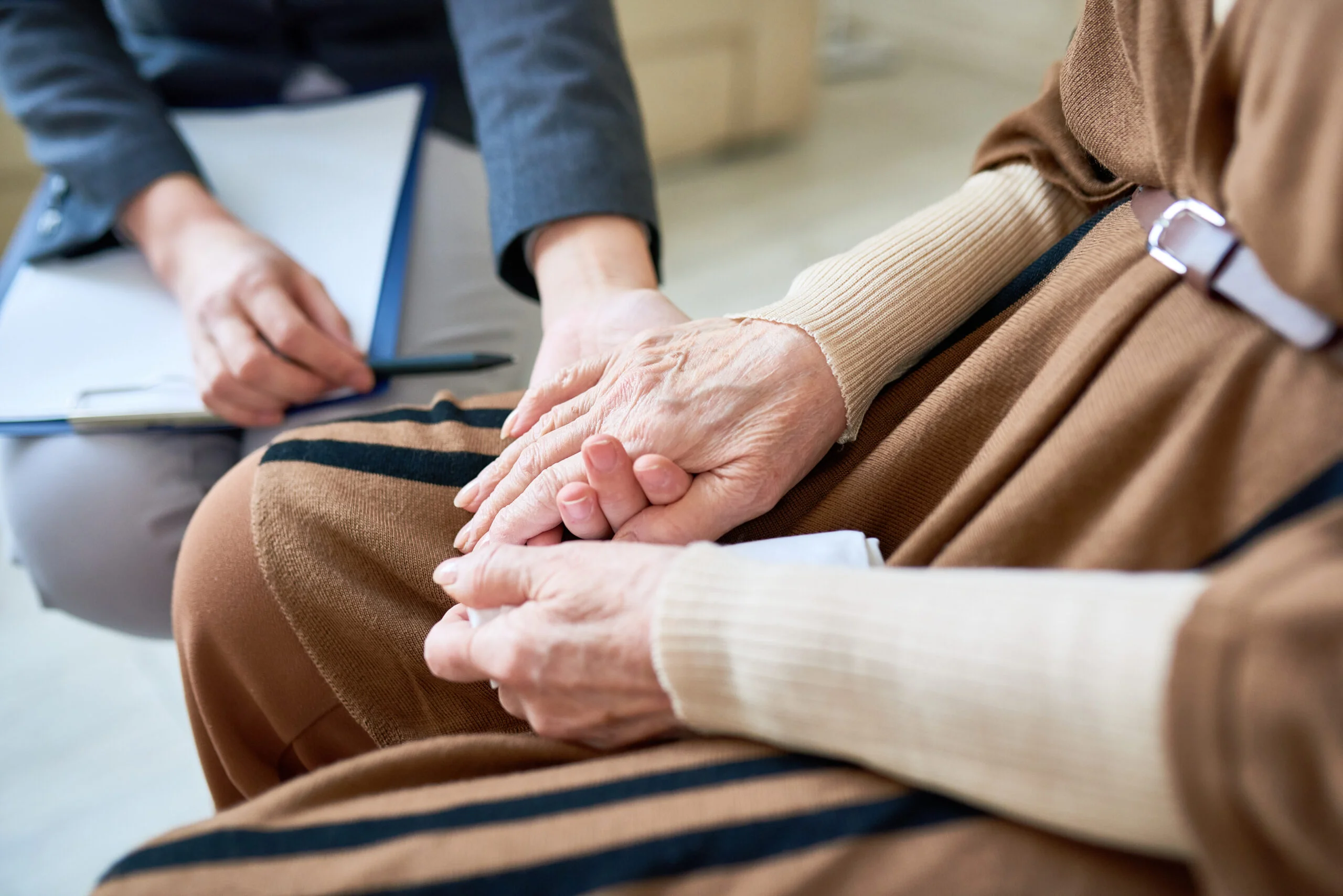Senior holding caretaker hand