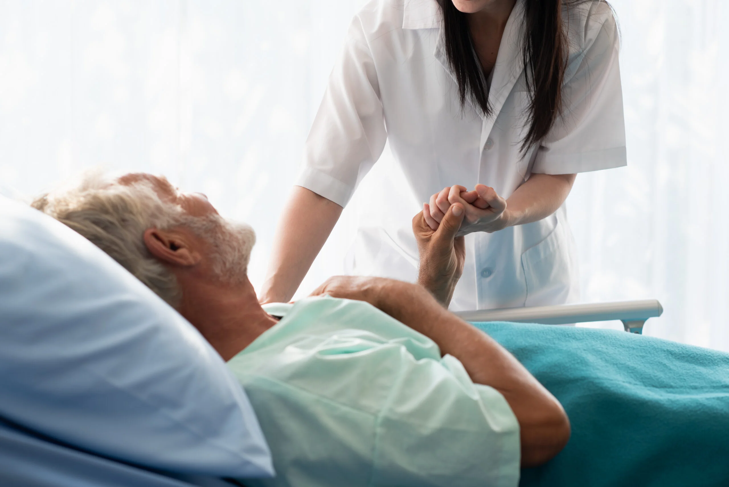 Caretaker comforting senior