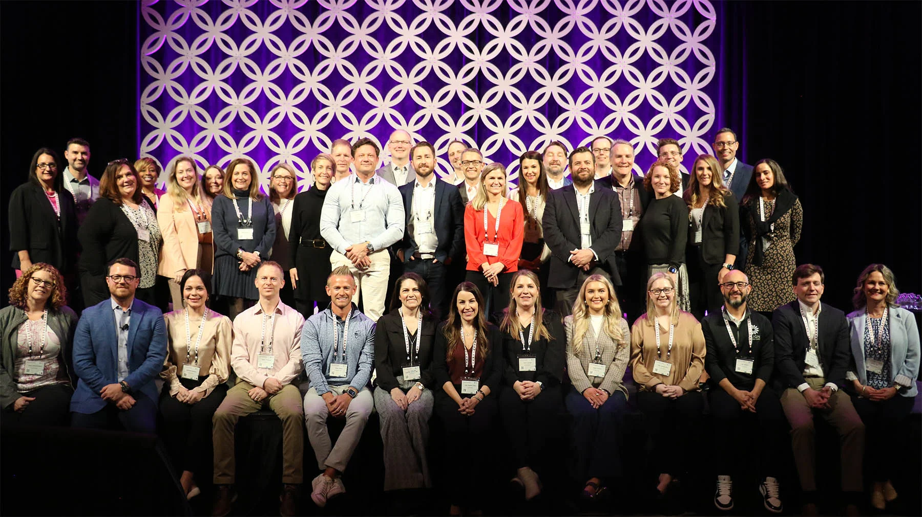 Curana team photo in front of patterned background