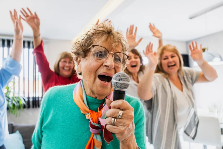 Seniors laughing and singing at karaoke night