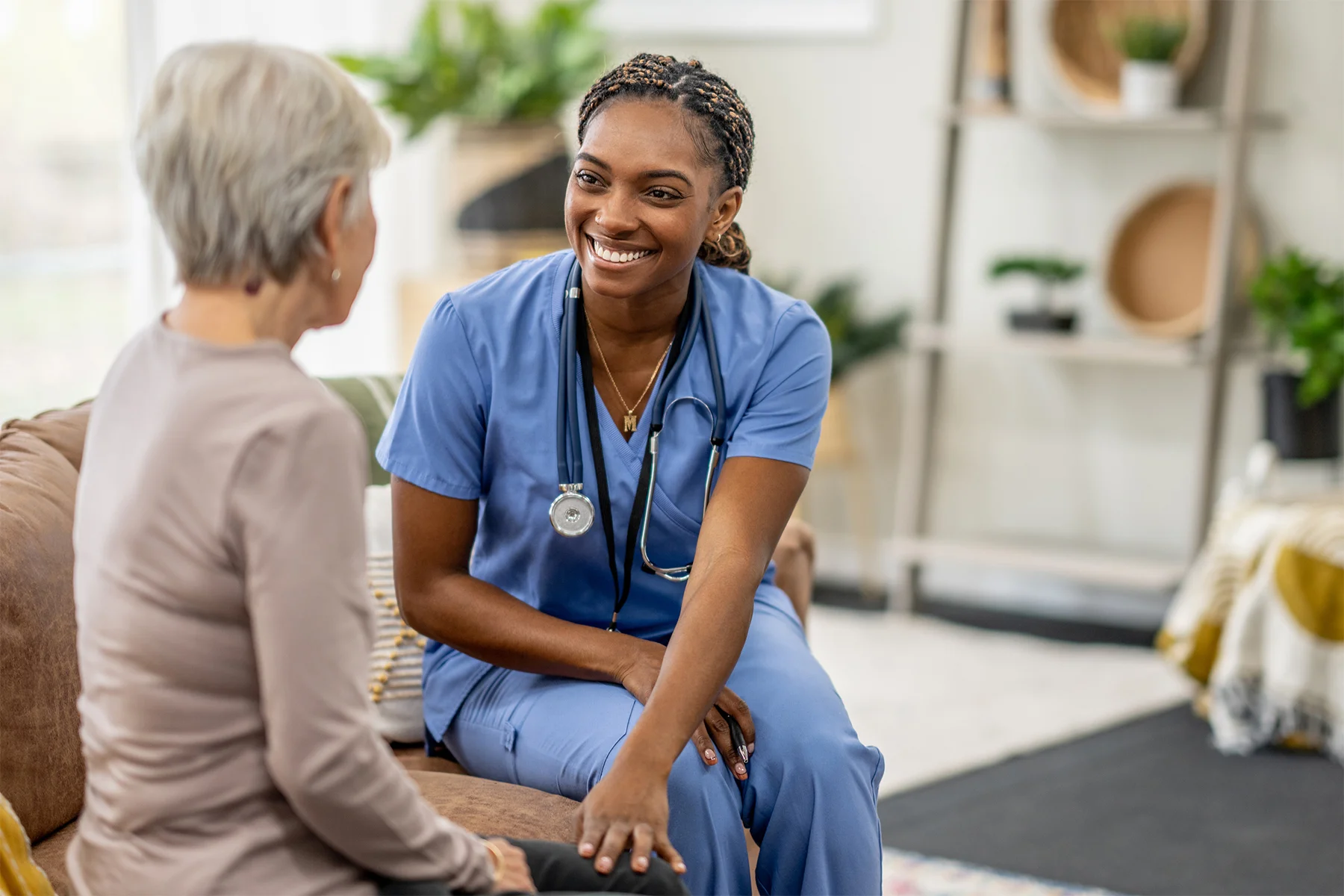 Nurse smiling talking to patient