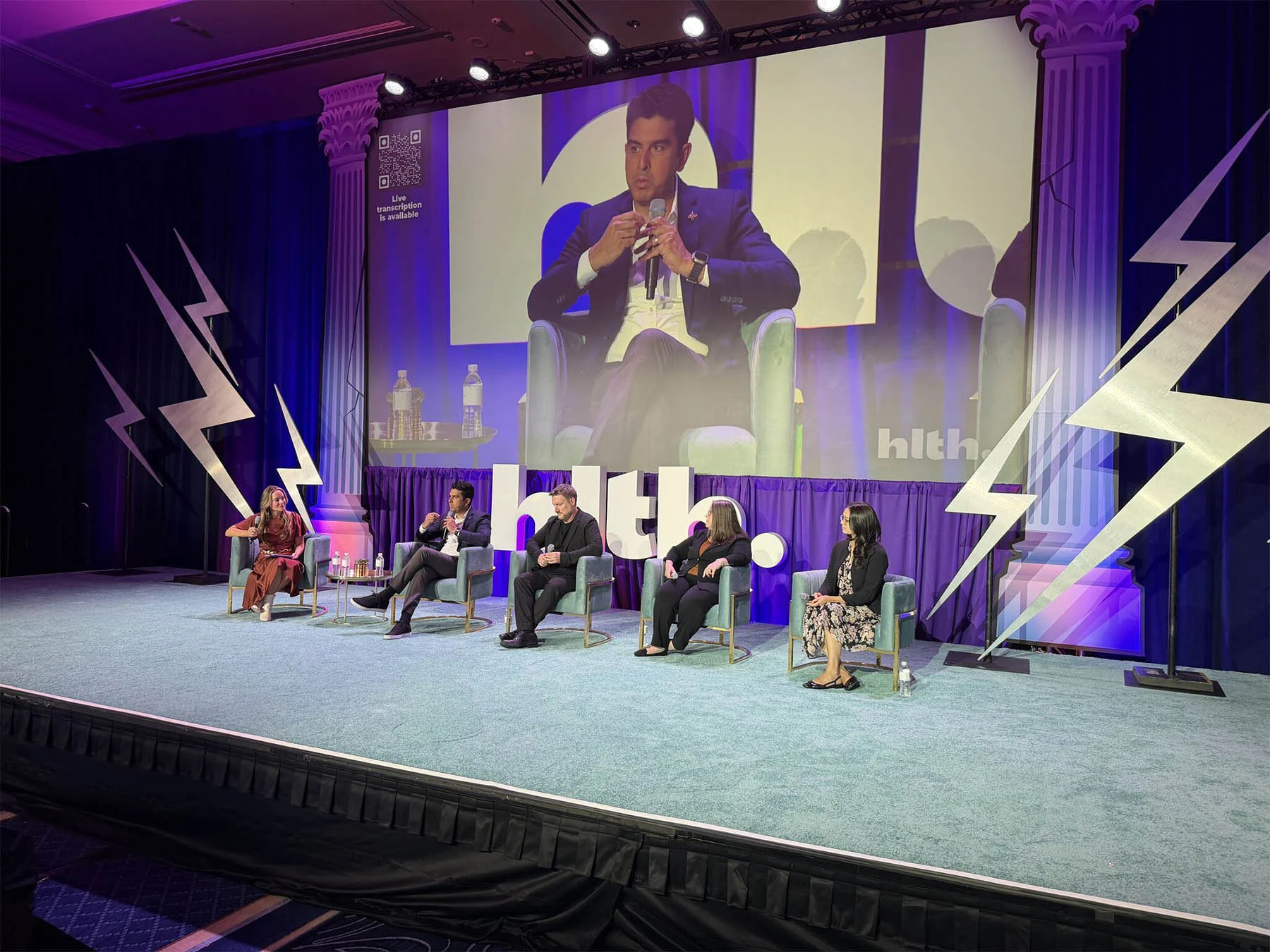 Curana Leadership speaking on stage at a conference